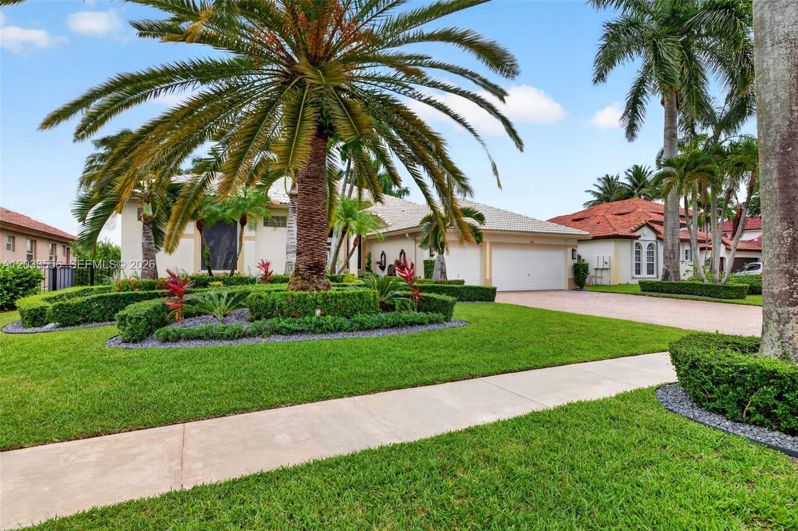 A single-story house with a palm tree in the front yard and a paved driveway — 18611 SW 39th St, Miramar FL 33029, MIRAMAR, FL