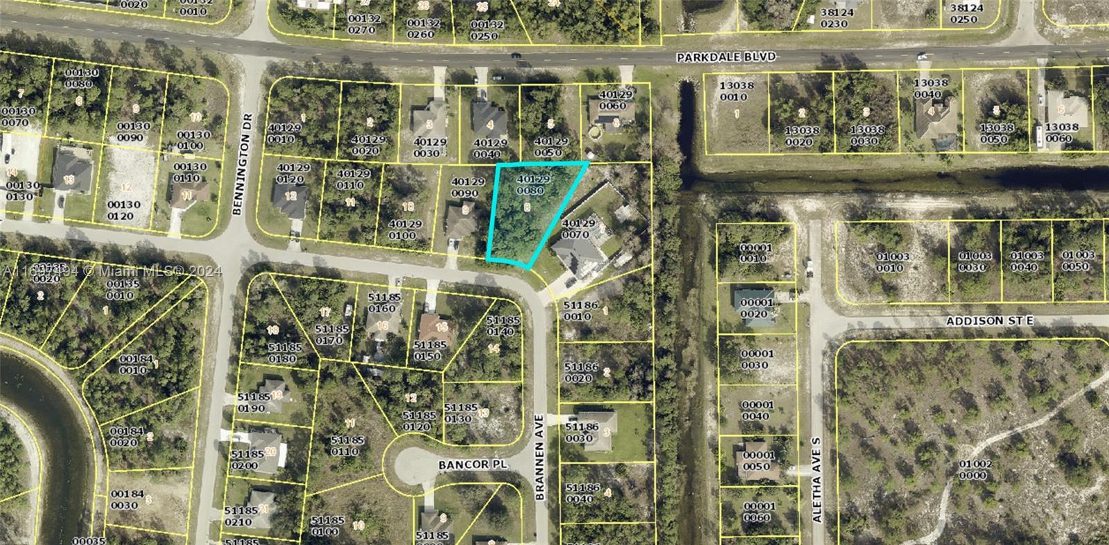 This is an aerial map showing a highlighted vacant residential lot in a suburban neighborhood — 439 Broadmoor St, Lehigh Acres FL 33974, LEHIGH ACRES, FL