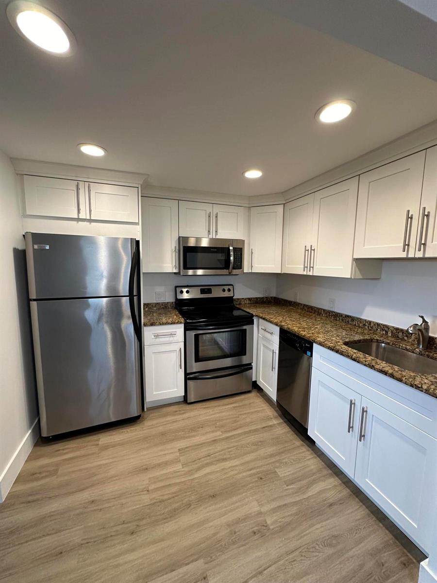 A kitchen with white cabinets, stainless steel appliances, and granite countertops — 50 Monaco # B, Delray Beach FL 33446, DELRAY BEACH, FL