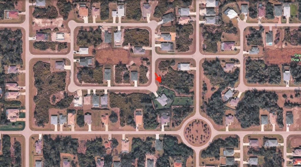 This is an aerial map view of a residential neighborhood with houses and wooded lots — 142 GREEN OAK PARK, ROTONDA WEST, FL
