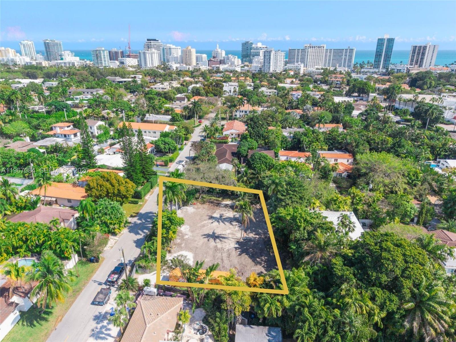 An aerial view shows a vacant, rectangular lot with palm trees and a storage container — 2880 Fairgreen Dr, Miami Beach FL 33140, MIAMI BEACH, FL