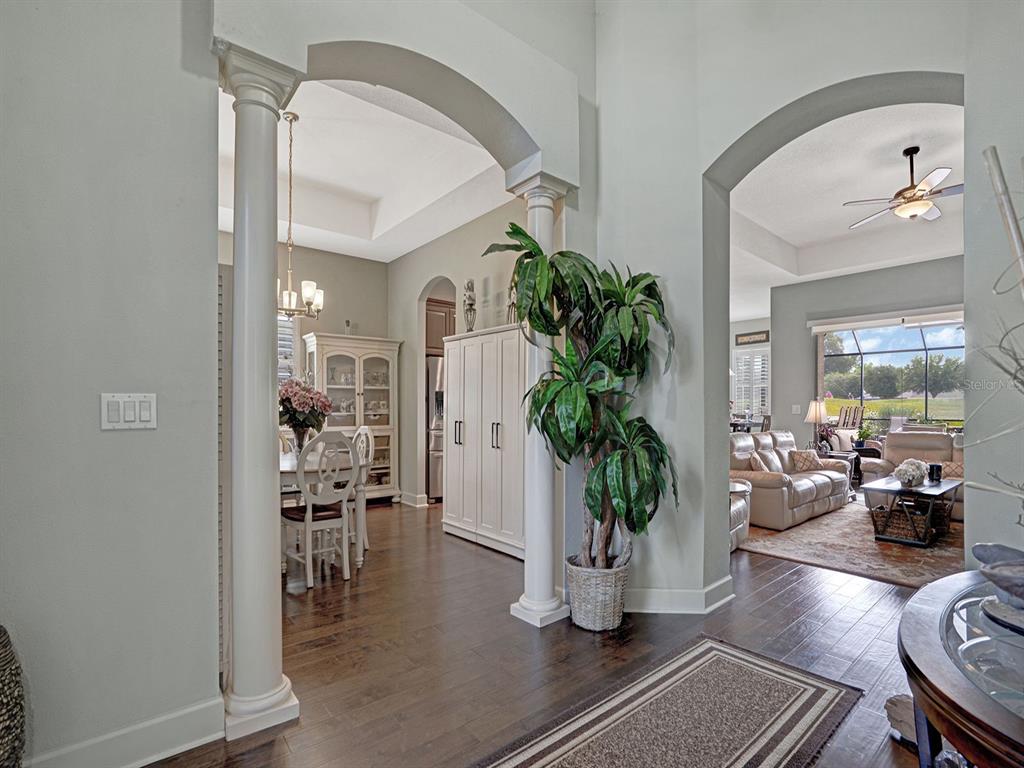 A view from a foyer looking into a dining room and a living room — 13422 NITI DRIVE, HUDSON, FL