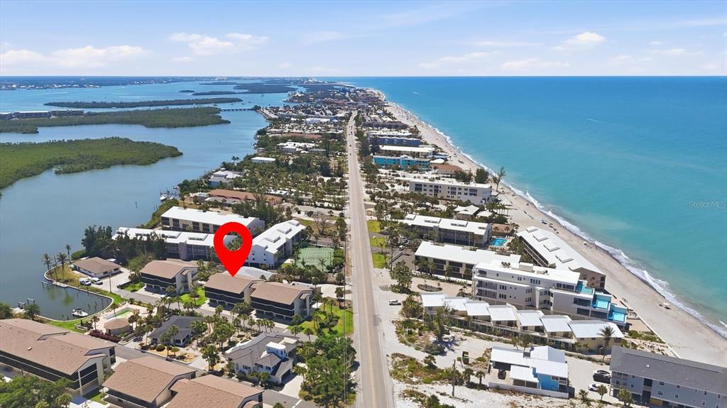 An aerial view shows a coastal neighborhood with a red pin marking a multi-story building — 2729 N BEACH ROAD UNIT 211, ENGLEWOOD, FL