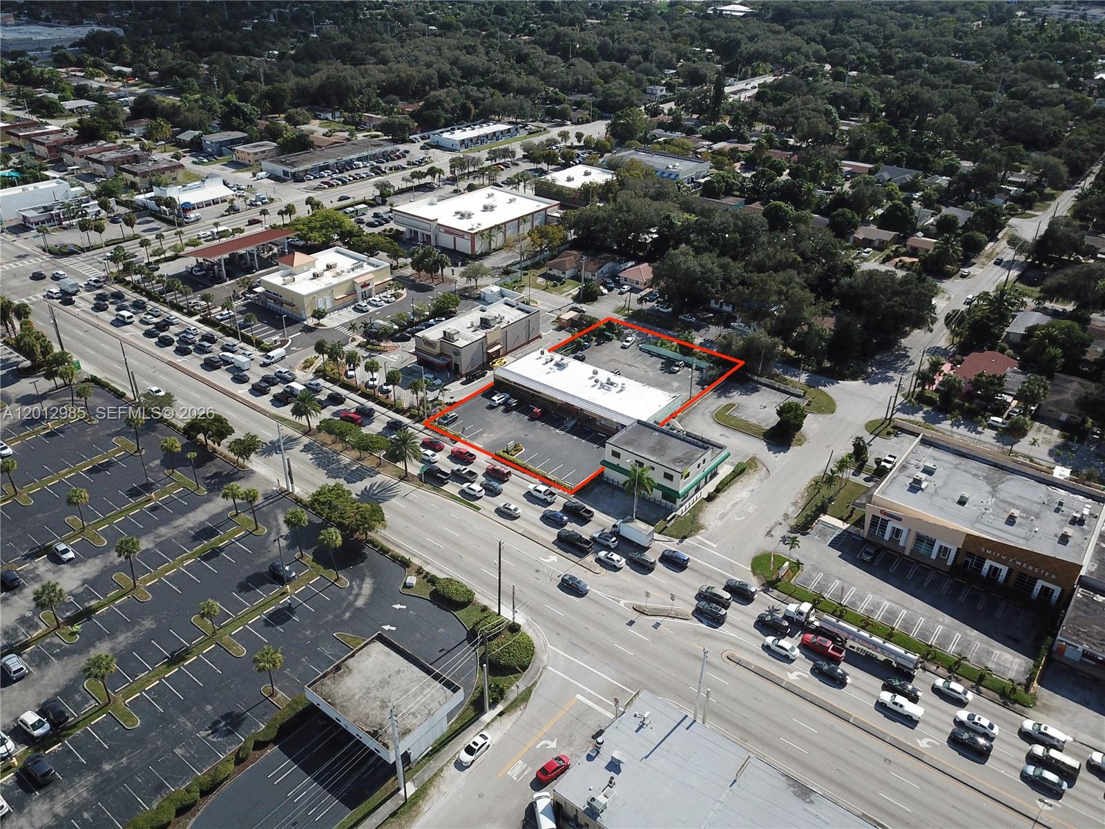 An aerial view shows a commercial building outlined in red with an adjacent parking lot — 510 NE 167th St # 510, Miami FL 33162, MIAMI, FL