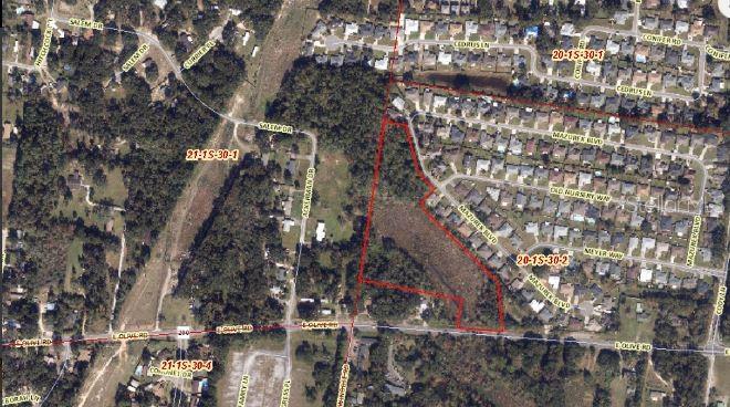 An aerial map shows a parcel of land outlined in red near a residential neighborhood — 720 E OLIVE ROAD, PENSACOLA, FL