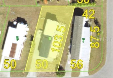 This is an aerial map view of a residential lot highlighted in yellow — 7360 TISA AVENUE, PORT CHARLOTTE, FL