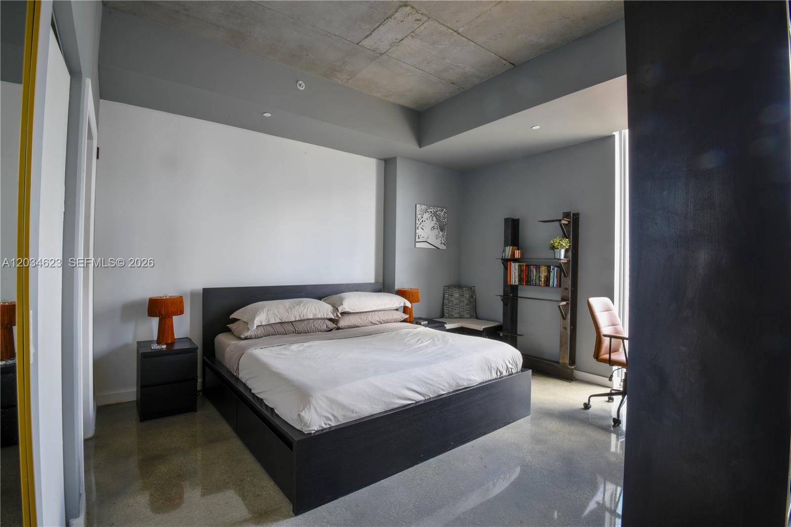 A modern bedroom features a platform bed, concrete ceiling, and polished concrete floors — 151 SE 1st St # 1907, Miami FL 33131, MIAMI, FL
