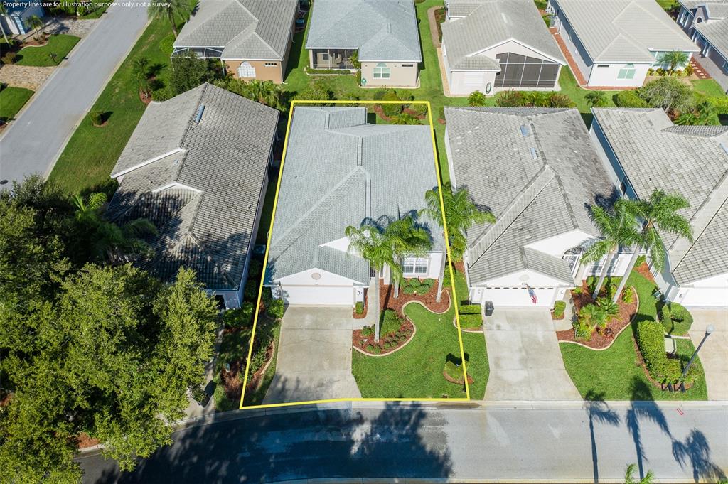 An aerial view shows a single-family house with a gray roof and a concrete driveway — 1239 STADLER DRIVE, NEW PORT RICHEY, FL