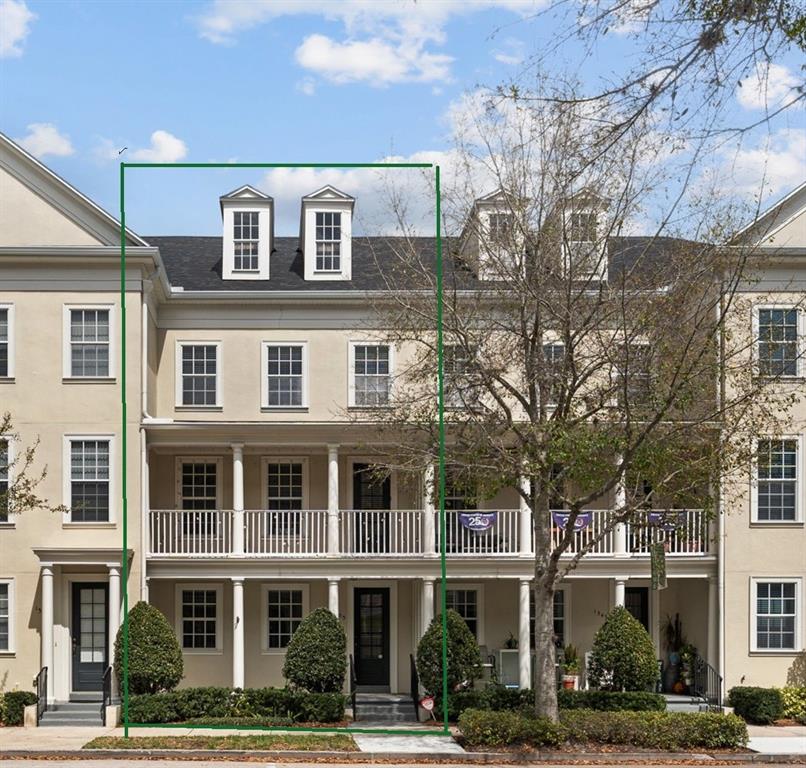 The exterior of a three-story townhouse features a second-floor balcony and two roof dormers — 1353 CHATFIELD PLACE, ORLANDO, FL