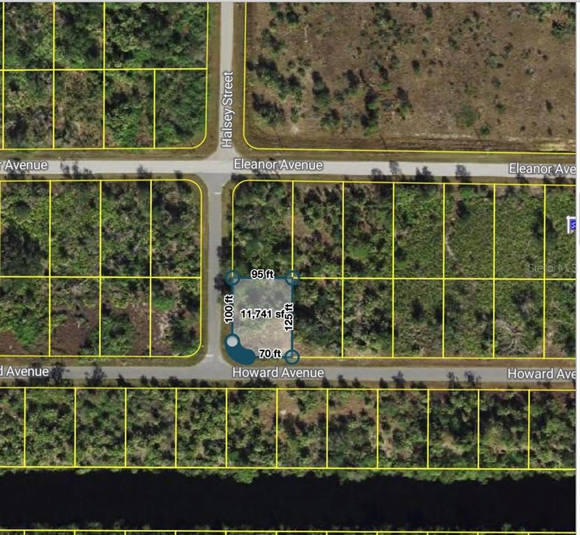 An aerial map shows a vacant rectangular lot at the corner of two paved streets — 14272 HOWARD AVENUE, PORT CHARLOTTE, FL