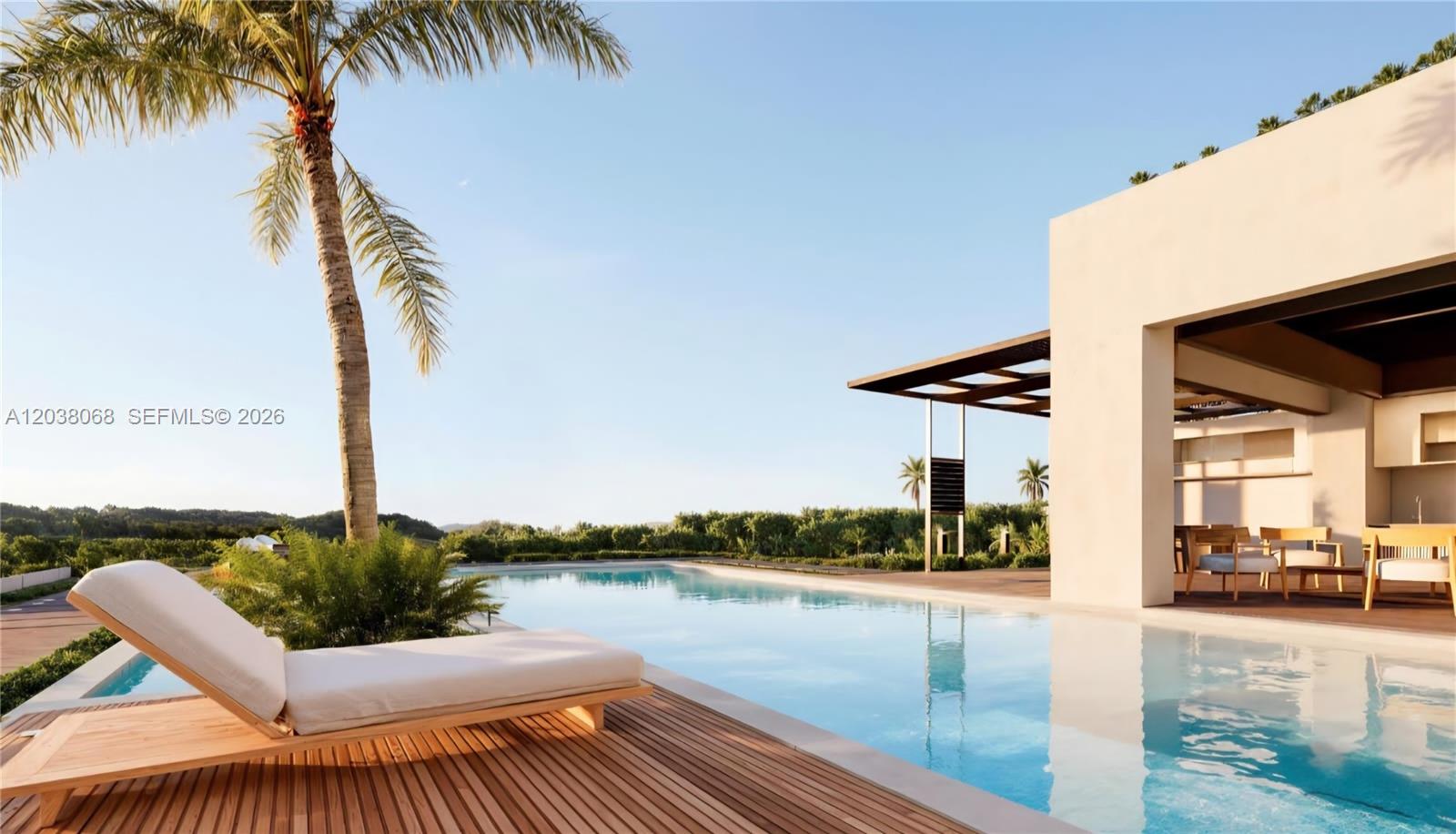 A modern outdoor patio features a swimming pool, lounge chair, and a palm tree — 0 villa majagua, FL