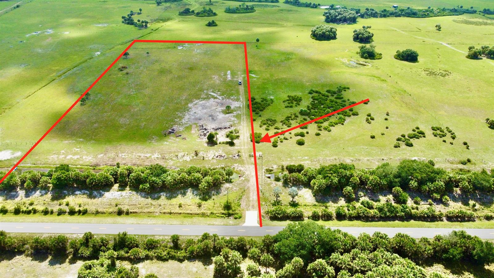 An aerial view shows a rectangular plot of land outlined in red bordering a road — 28095 NW 72nd Avenue, Okeechobee FL 34972, OKEECHOBEE, FL