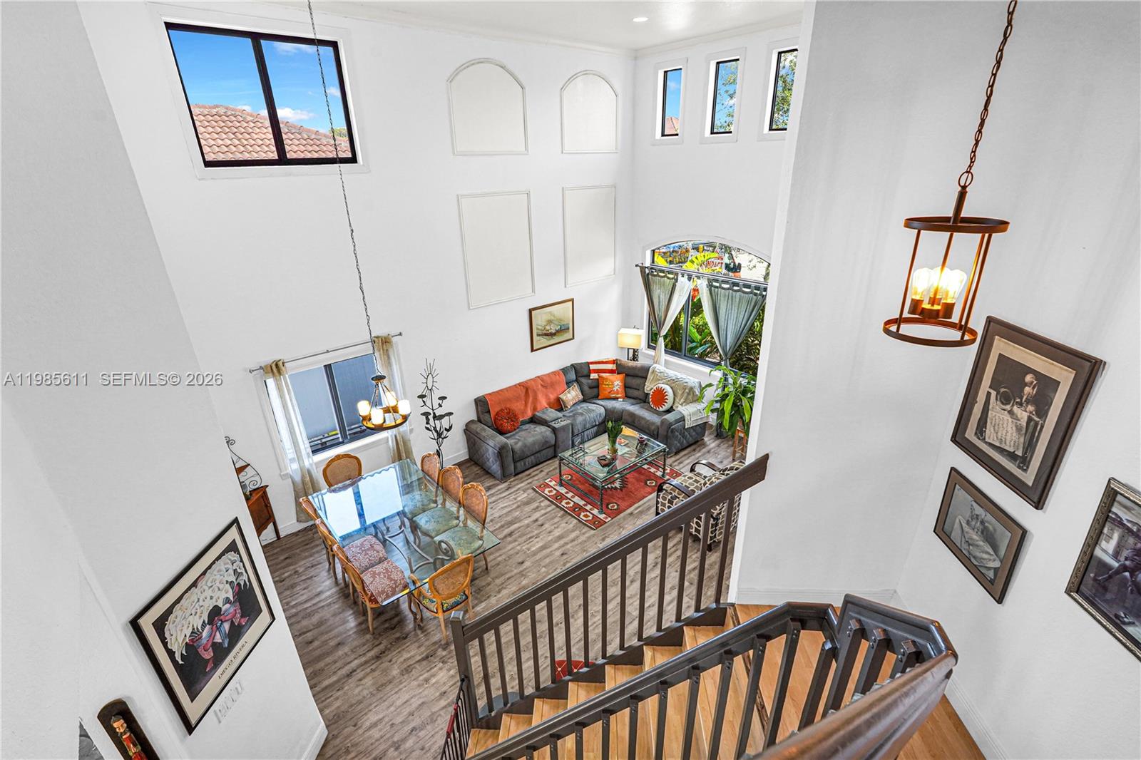 A high-angle view shows a two-story living and dining area with vaulted ceilings — 22542 SW 103rd Ct, Cutler Bay FL 33190, CUTLER BAY, FL
