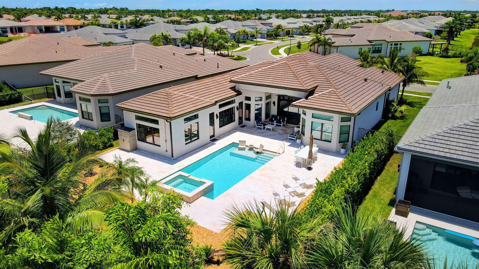 An aerial view of a house with a swimming pool, patio, and landscaped backyard — 11158 Glen Orchard Lane, Boynton Beach FL 33473, BOYNTON BEACH, FL