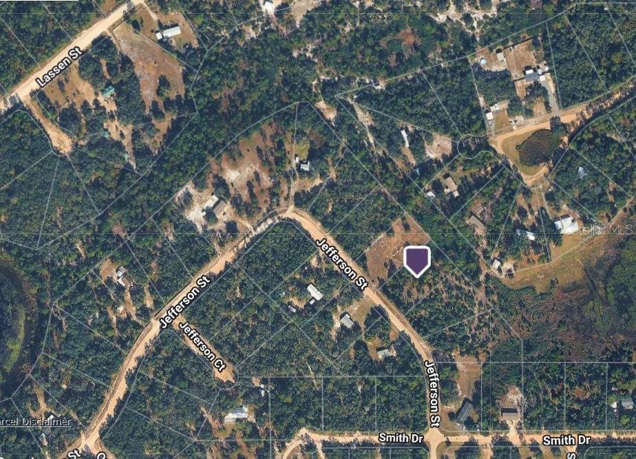 An aerial map view shows a wooded residential area with a highlighted property lot — 5504 JEFFERSON STREET, KEYSTONE HEIGHTS, FL