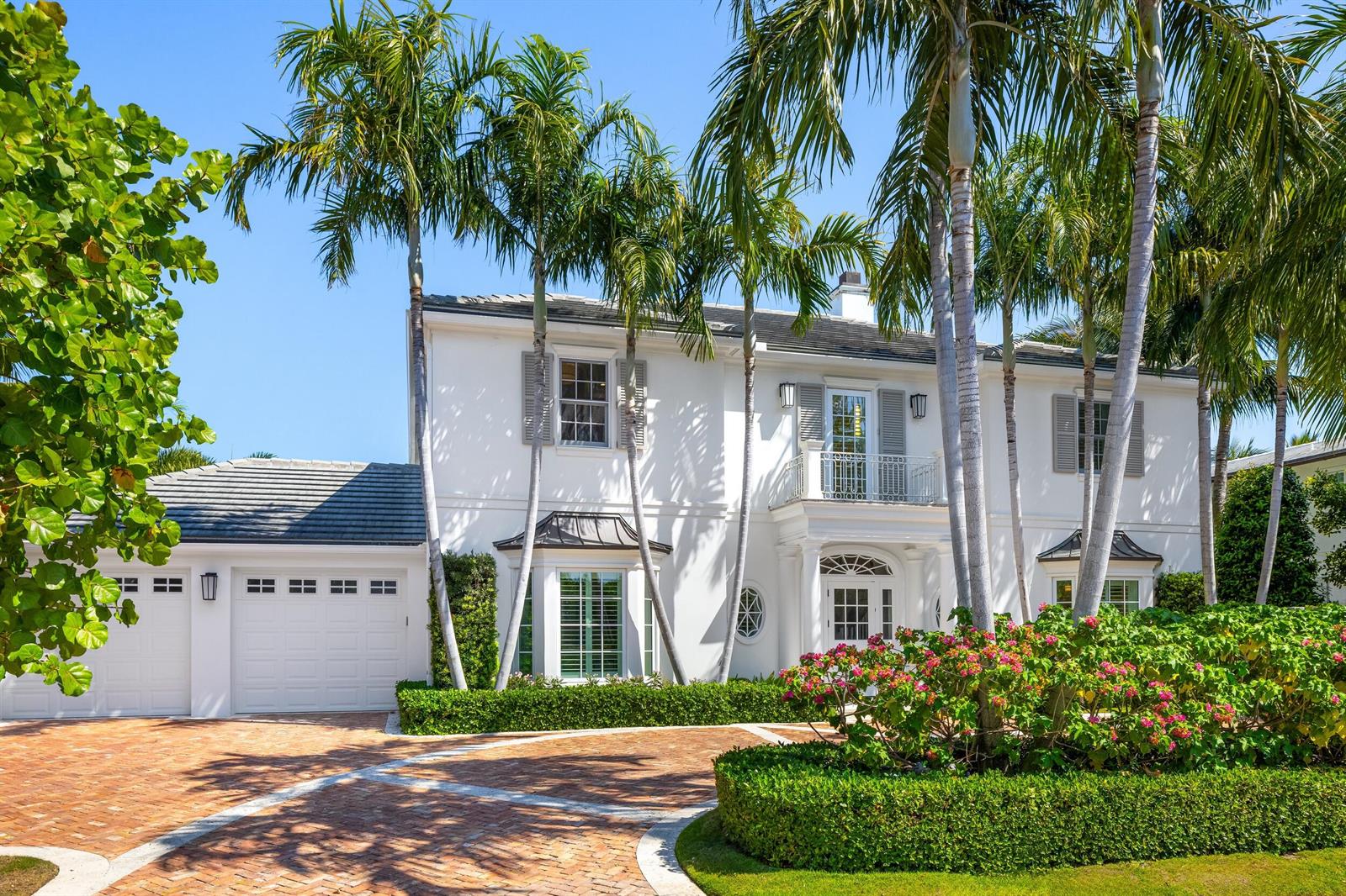 A two-story white house with a brick driveway, palm trees, and a manicured hedge — 211 Ocean Terrace, Palm Beach FL 33480, PALM BEACH, FL