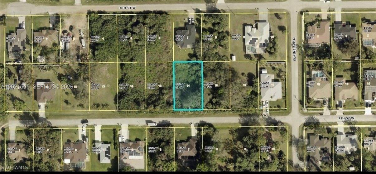 This is an aerial map showing a vacant, rectangular lot highlighted in blue — 2706 7th St West, Lehigh Acres FL 33971, LEHIGH ACRES, FL