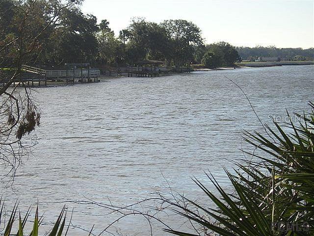 A view of a calm body of water with wooden docks along the shoreline — 5150 N OCEAN SHORE BOULEVARD, PALM COAST, FL
