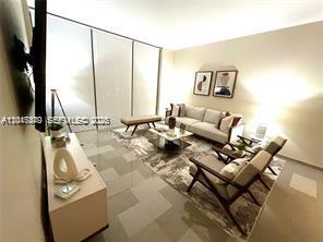 A modern living room features a light-colored sofa, two armchairs, and a coffee table — 68 SE 6th St # 906, Miami FL 33131, MIAMI, FL