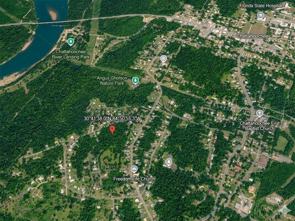 This is an aerial map showing a residential area near parks and the Chattahoochee River — SATSUMA RD, CHATTAHOOCHEE, FL