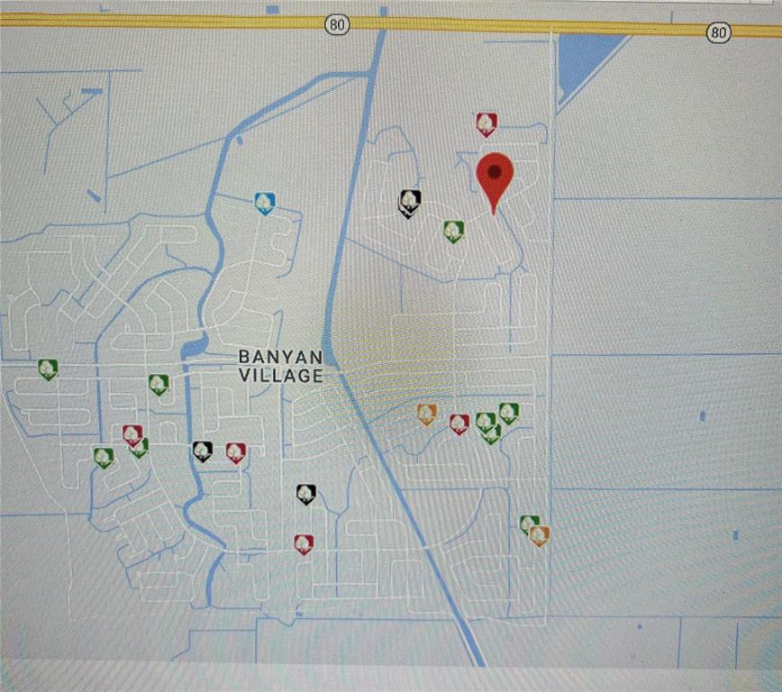 This map displays the Banyan Village neighborhood with various property markers and a red pin — 216 ELMWOOD STREET, LABELLE, FL