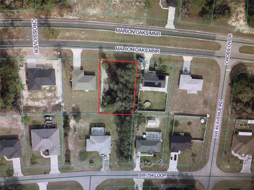 This is an aerial map showing a vacant residential lot outlined in red — 0 MARION OAKS MANOR, OCALA, FL