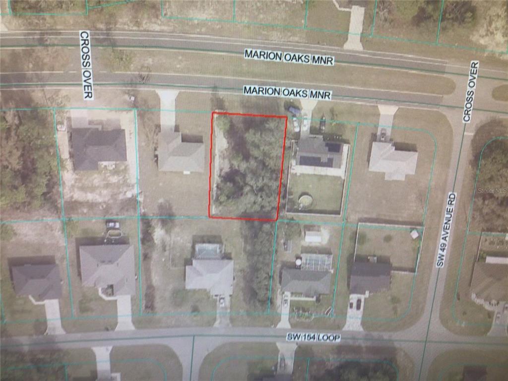 This is an aerial map showing a vacant, rectangular lot outlined in red — 0 MARION OAKS MANOR, OCALA, FL