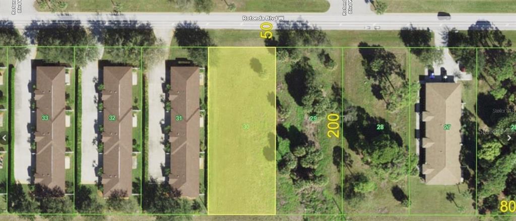 This aerial map shows a vacant rectangular lot highlighted in yellow between two residential buildings — 205 ROTONDA BOULEVARD W UNIT 3, ROTONDA WEST, FL