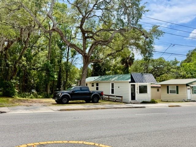 A black pickup truck is parked in front of a small, light-colored house — 270 N BROAD STREET, BROOKSVILLE, FL