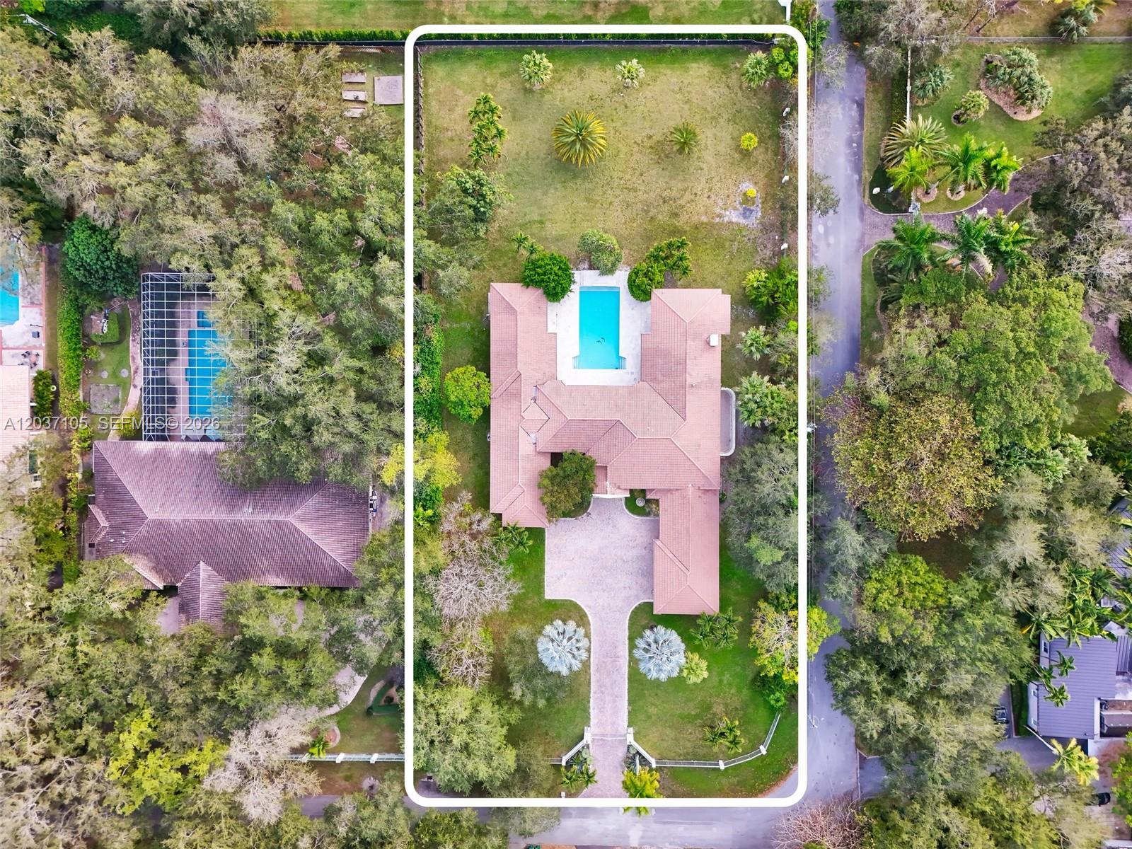 An aerial view shows a house with a swimming pool and a large backyard — 8480 SW 98th St, Miami FL 33156, MIAMI, FL