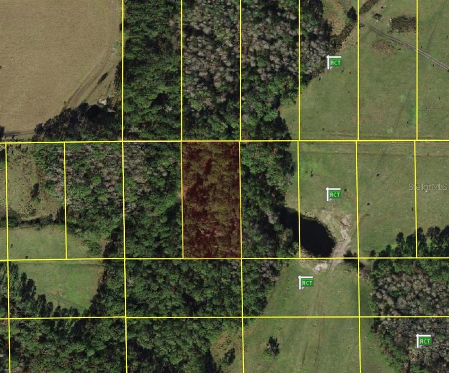 This is an aerial map showing a highlighted rectangular plot of land among surrounding parcels — POLK CITY, POLK CITY, FL