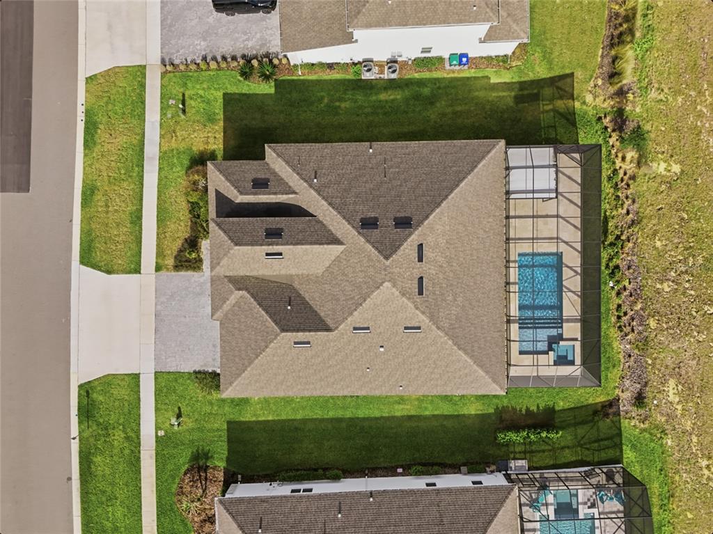 An aerial view shows a house with a shingled roof and a screened-in pool — 16071 BARKLY RIDGE COURT, WINTER GARDEN, FL
