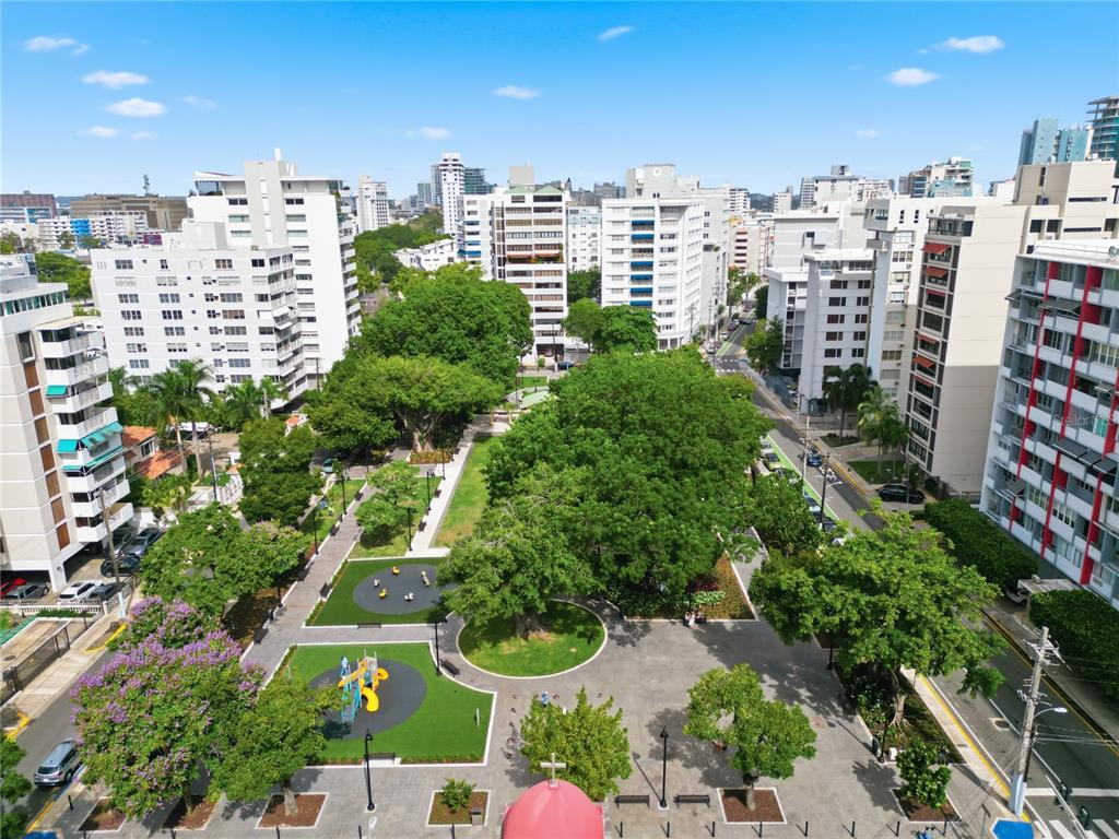 An elevated view of a city park surrounded by high-rise apartment buildings — 1223 LUCHETTI STREET UNIT 801, SAN JUAN, PR