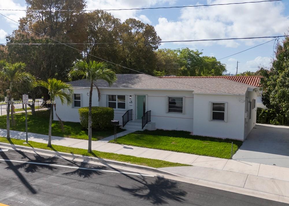 A single-story white house with a gray roof sits behind a sidewalk and palm trees — 3200 SW 2nd St, Miami FL 33135, MIAMI, FL