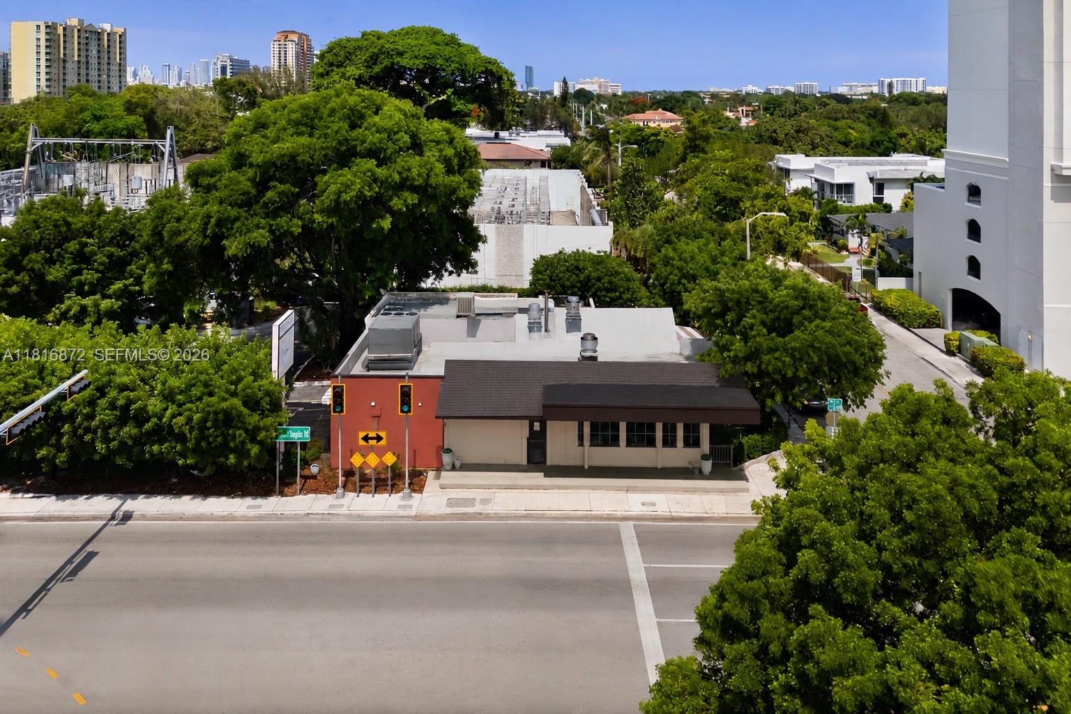 An aerial view shows a small commercial building with a red facade and brown roof — 2345 SW 37th Ave, Miami FL 33145, MIAMI, FL