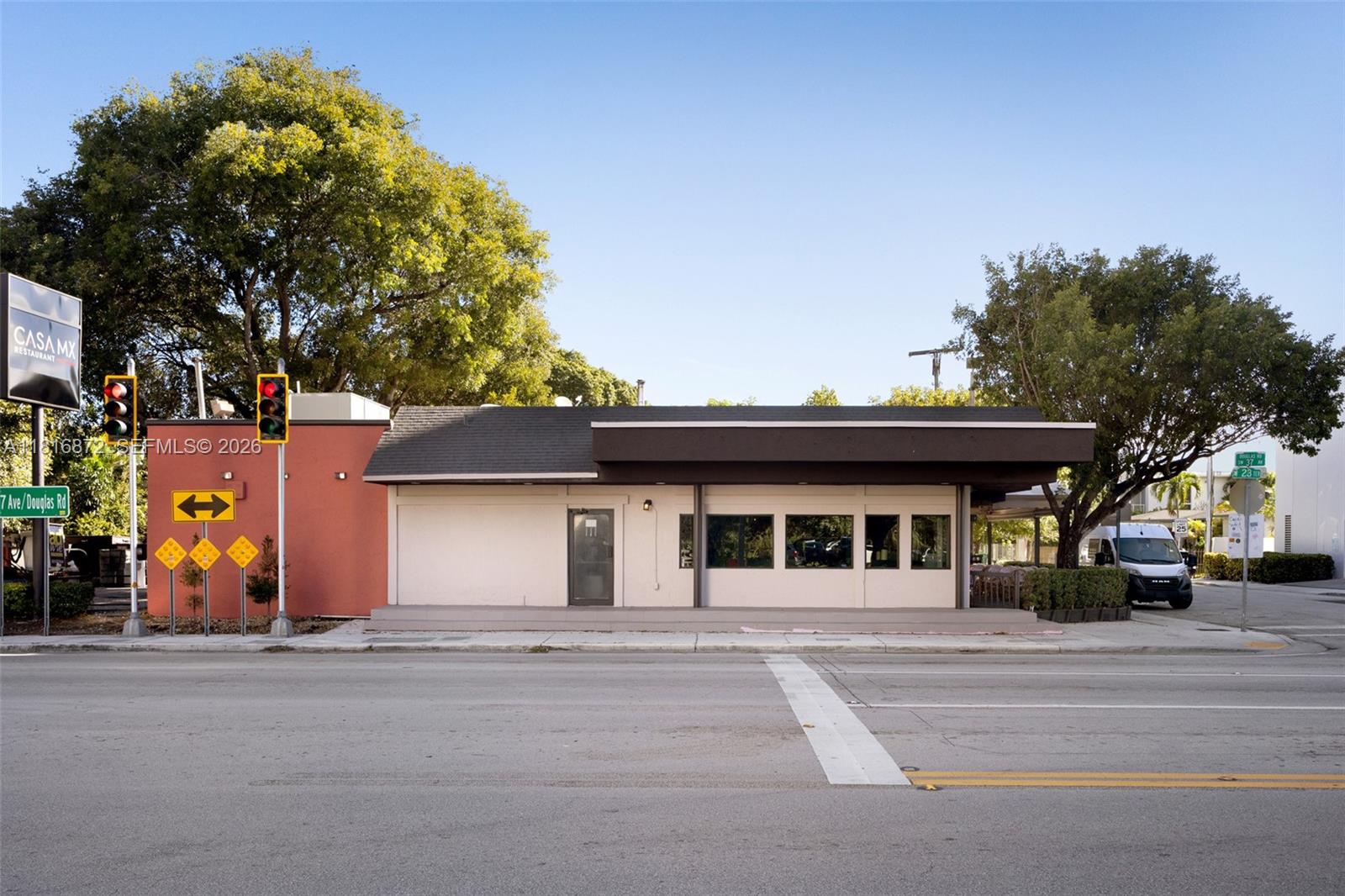 A single-story commercial building with a red accent wall and a flat roof — 2345 SW 37th Ave, Miami FL 33145, MIAMI, FL