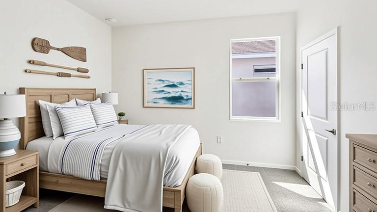 A bedroom features a wooden bed frame, nautical wall decor, and a window with blinds — 4015 NW 44TH CIRCLE, OCALA, FL