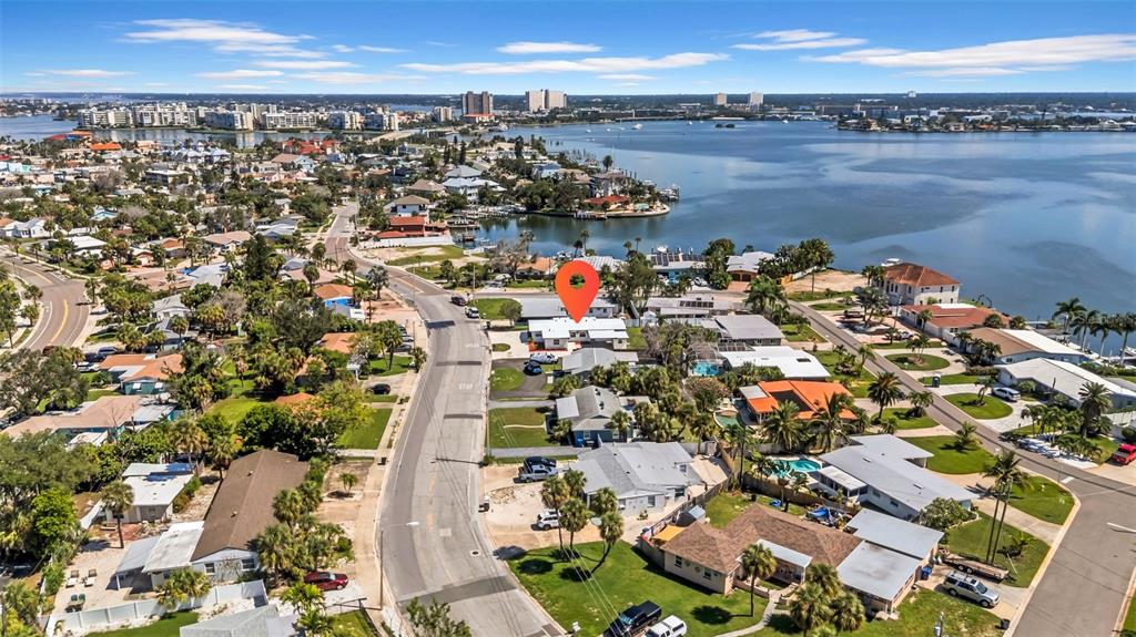 This aerial view shows a residential neighborhood with a red location pin on a house — 6855 GULF WINDS DRIVE, ST PETE BEACH, FL