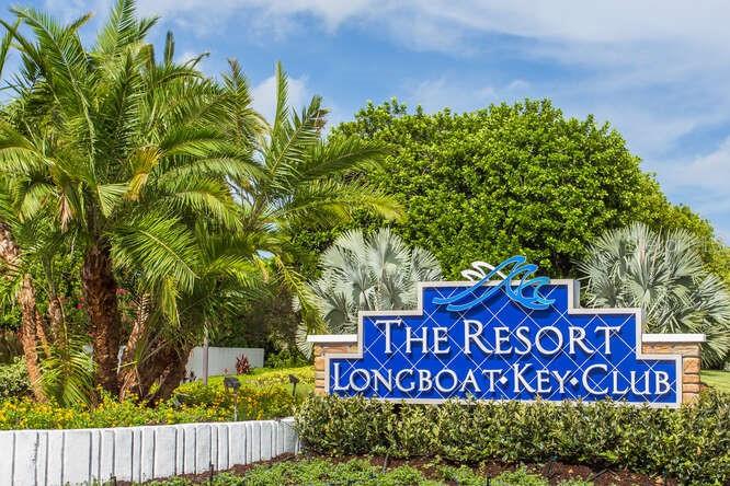 A blue sign for The Resort at Longboat Key Club stands among palm trees — 250 SANDS POINT ROAD UNIT 5203, LONGBOAT KEY, FL