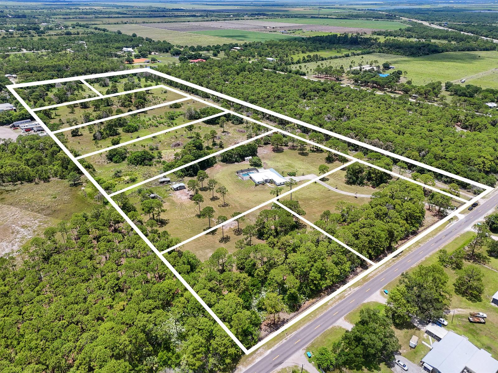 An aerial view shows a large, rectangular plot of land divided into several smaller parcels — 425 N Ffa Road, Fort Pierce FL 34945, FORT PIERCE, FL