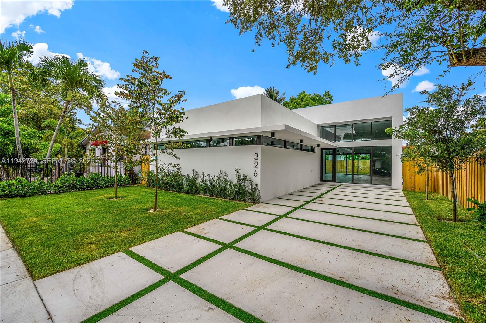 A modern white house with a flat roof and a concrete paver driveway — 326 NW 40th St, Miami FL 33127, MIAMI, FL