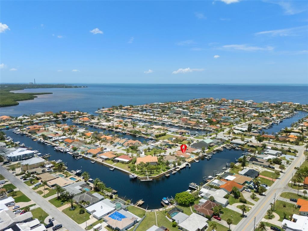 An aerial view shows a waterfront residential neighborhood with a red pin marking a house — 3517 SEAWAY DRIVE, NEW PORT RICHEY, FL