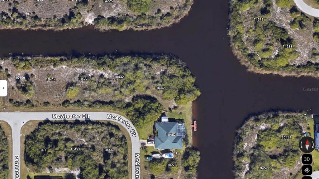 This is an aerial map view of a waterfront property and surrounding lots — 10442 MCALESTER CIRCLE, PORT CHARLOTTE, FL