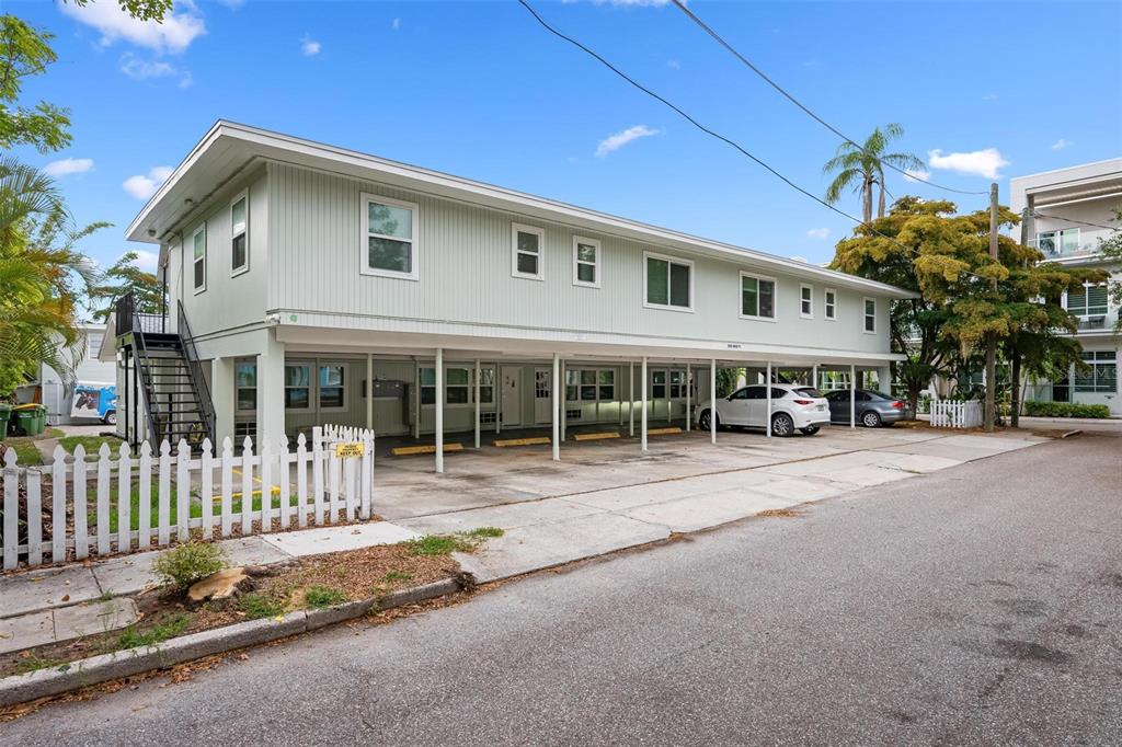A two-story apartment building with covered ground-level parking and an exterior staircase — 308 OHIO PLACE UNIT 2, SARASOTA, FL