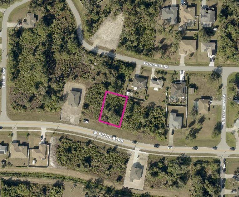 This aerial map shows a vacant, rectangular lot highlighted in pink along a residential road — PRICE BOULEVARD, NORTH PORT, FL