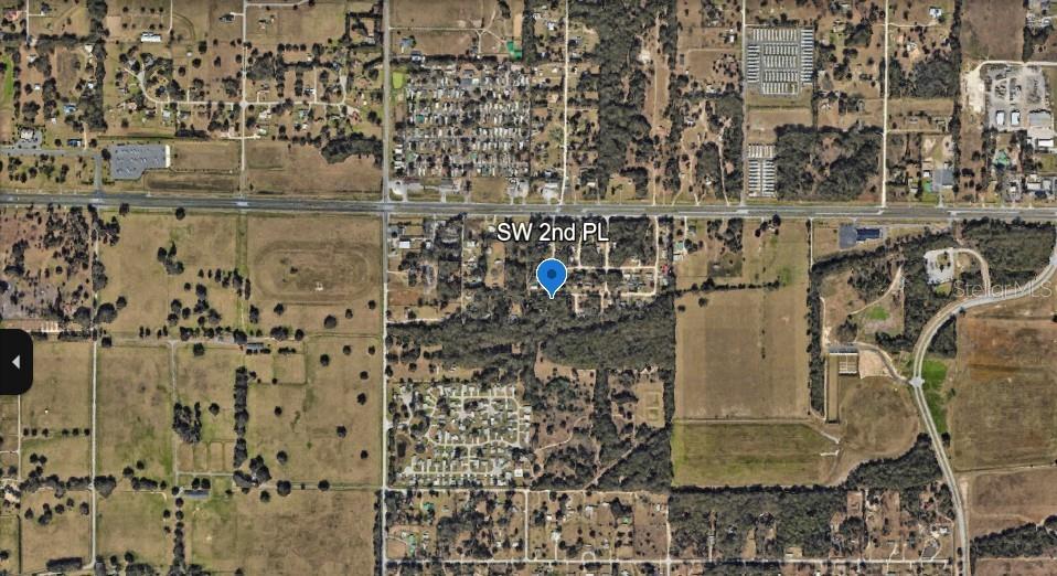 This is an aerial map view showing a residential area with a blue location pin — 00 SW 2ND PL, OCALA, FL