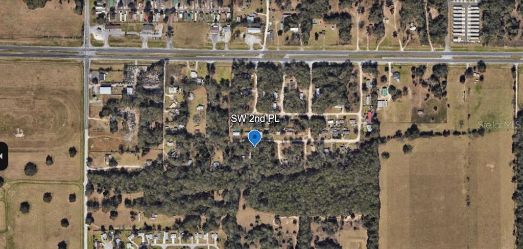 This is an aerial map view showing a residential area with wooded lots and roads — 00 SW 2ND PL, OCALA, FL