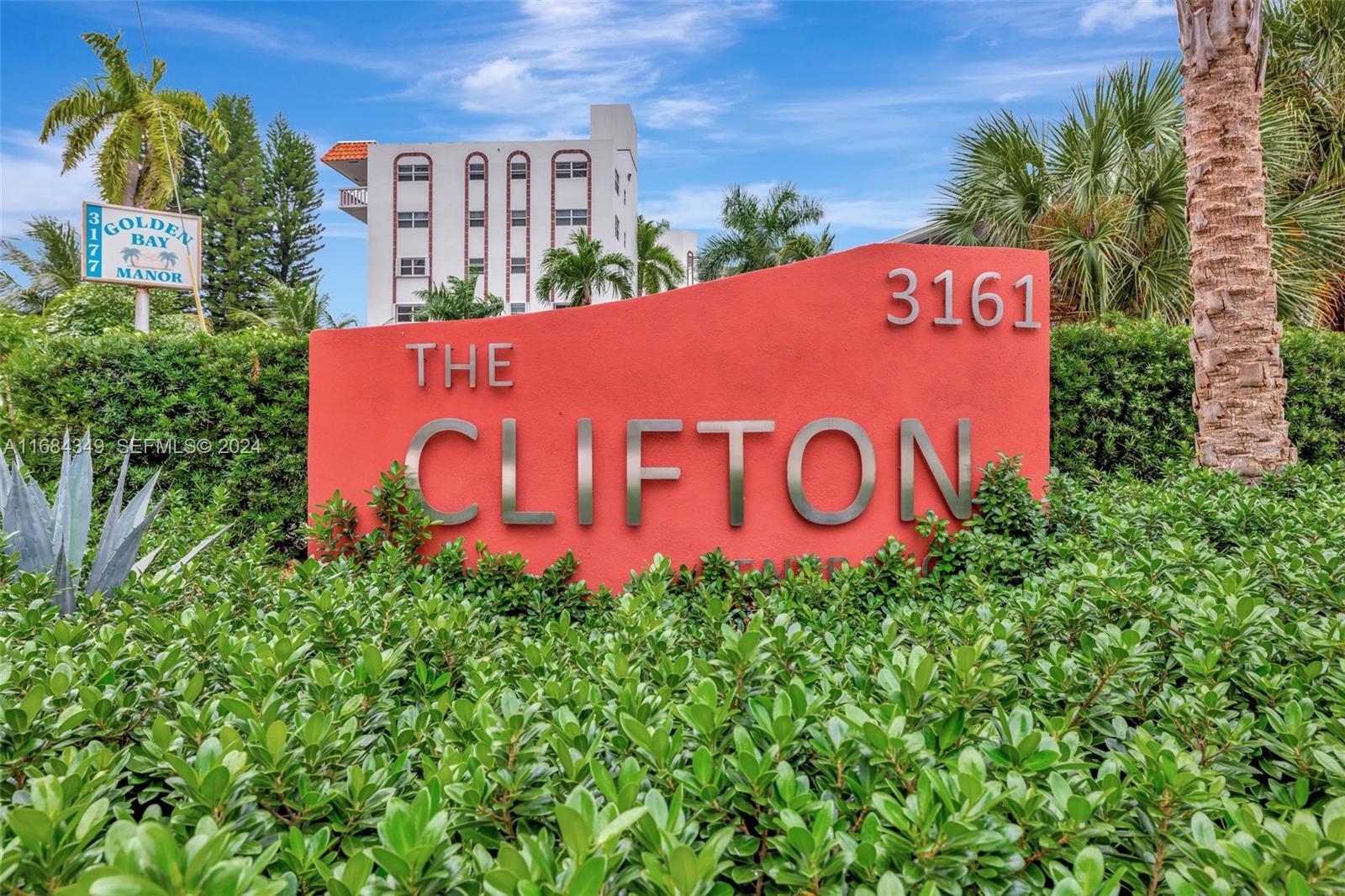 A red sign for The Clifton stands in front of a multi-story apartment building — 3161 S Ocean Dr # 203, Hallandale Beach FL 33009, HALLANDALE BEACH, FL