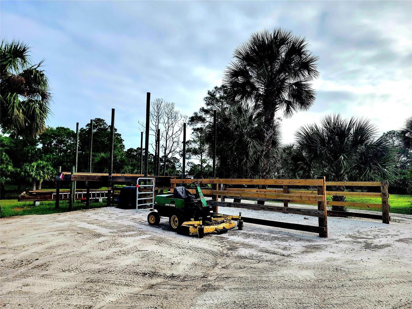 An outdoor wooden platform structure stands in a grassy field with several tall vertical posts — 15350 93rd Street, Fellsmere FL 32948, FELLSMERE, FL
