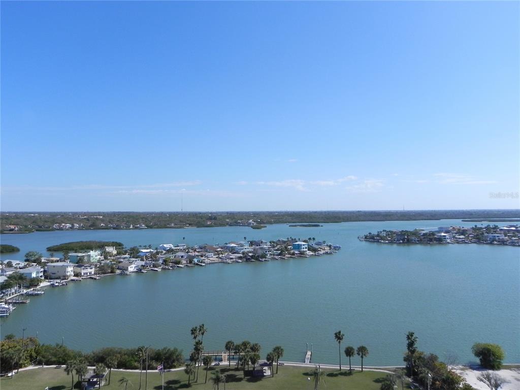 An elevated view of a coastal waterway with houses along the shoreline and islands — 17920 GULF BOULEVARD UNIT 1901, REDINGTON SHORES, FL